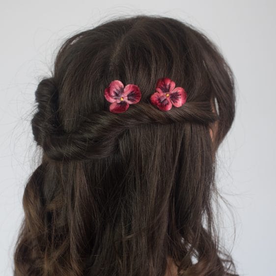 Deep Red, Velvet Pansies, worn with a twisted half up do
