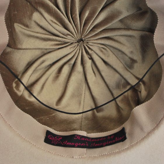 Close up interior shot, showing luxurious, gold silk dupion lining.