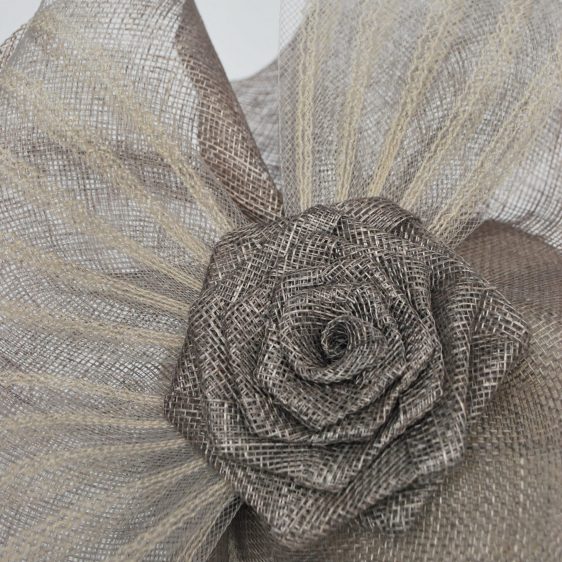 Close up of handmade sinamay straw flower