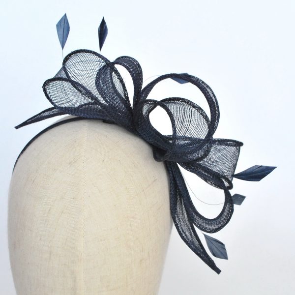 Navy Blue Sinamay Fascinator with Loops and Feathers worn to the left of the head