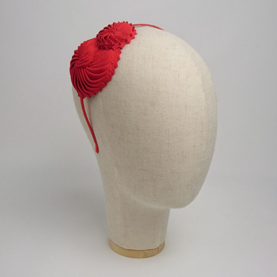 Red Nautilus Shell Headband, angled side view.
