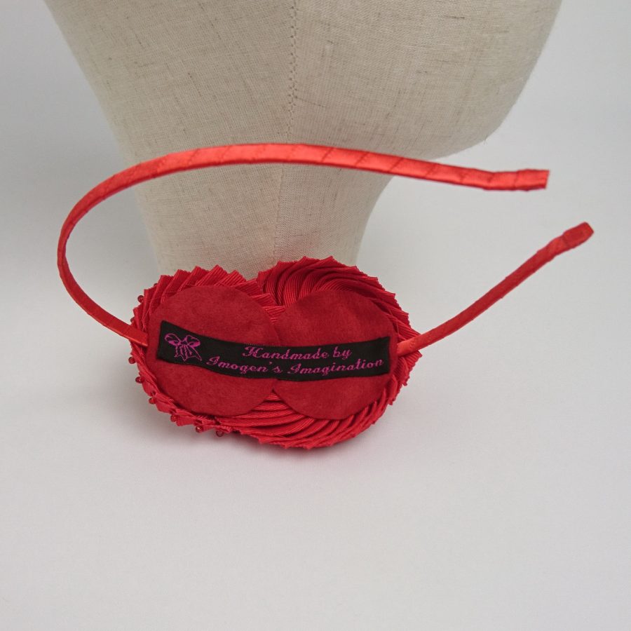 Handmade ribbon headband by Imogen's Imagination. Inside of headband, showing felt backing of the nautilus shell decoration.