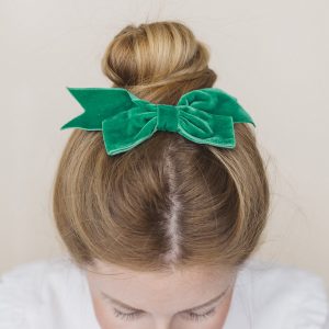 Emerald Green Velvet Ribbon Bow Hair Clip worn with a top knot bun