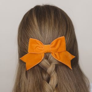 Orange Velvet Hair Bow worn with a braid