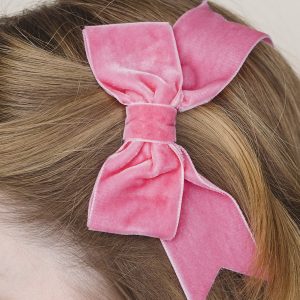 Bubblegum Pink Velvet Ribbon Hair Bow worn to the side of the head