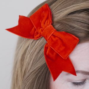 Red Velvet Hair Bow detail worn to the side of the head