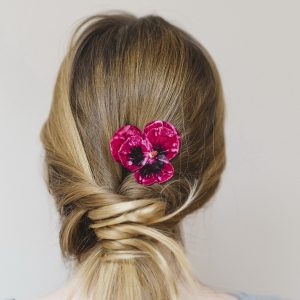 Fuchsia Pansy Flower Hair Clip worn with ponytail