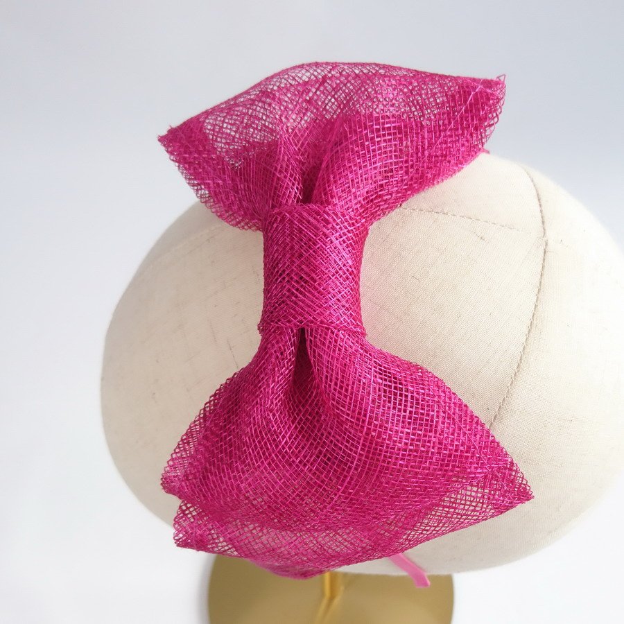 Dark Pink Wedding Fascinators - Detail shot, from above, of large sinamay bow