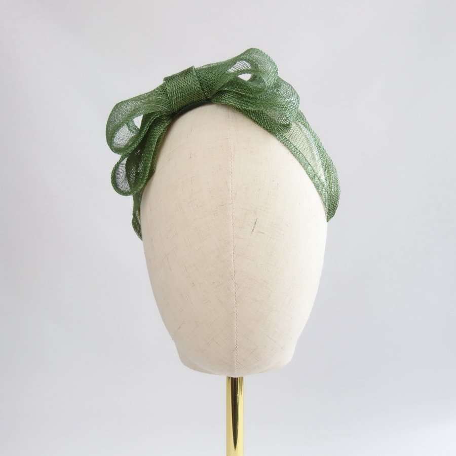 Green Wedding Fascinators - Front view of Green Large Sinamay Bow Fascinator, worn to the right