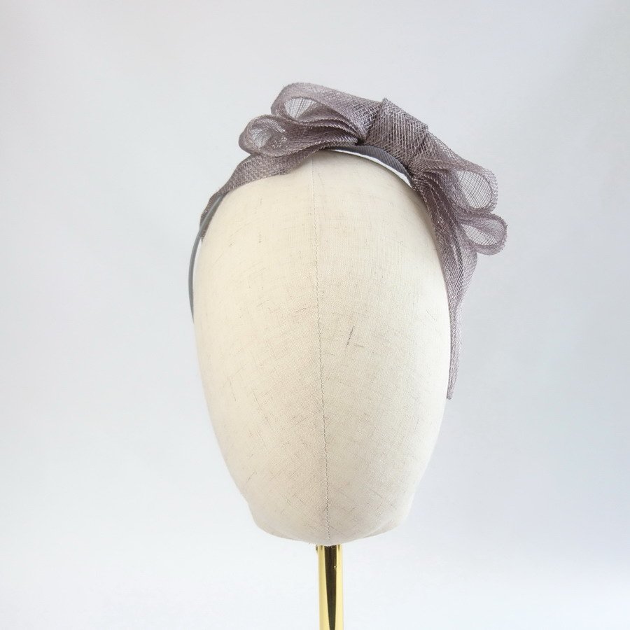 Pewter Grey Feather Free Fascinators - front view of fascinator with bow worn to the left