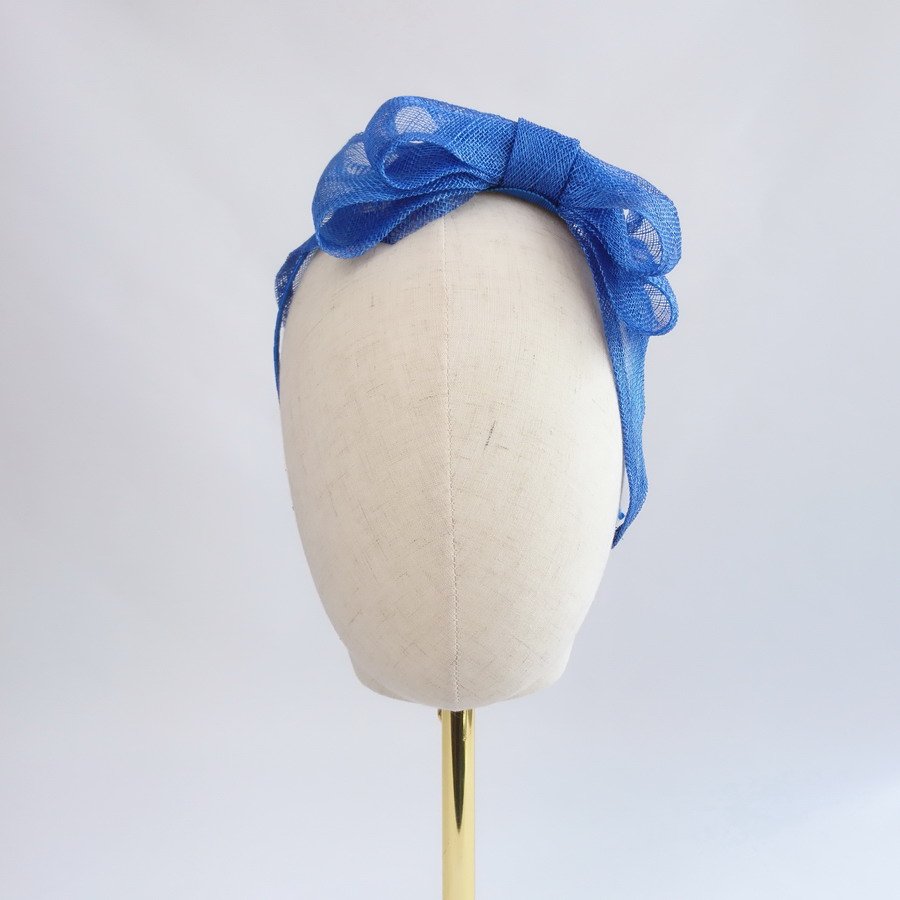 Royal Blue Summer Hair Accessories - Royal Blue Large Sinamay Bow Fascinator, worn to the left.