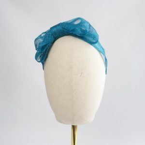 Teal Large Sinamay Bow Fascinator - front view, worn to the right