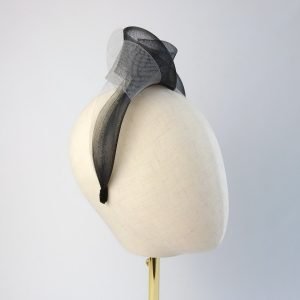 Black Grey Crinoline Knot Headband worn to the right of the head