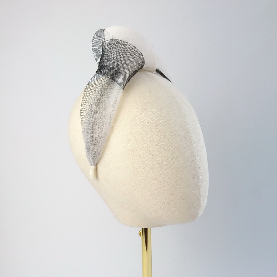 Ivory Black Crinoline Knot Headband worn to the right of the head