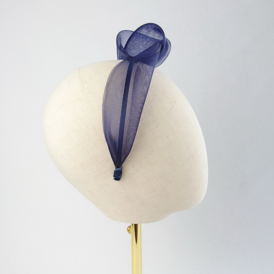 Navy Blue Crinoline Knot Headband worn to the left of the head