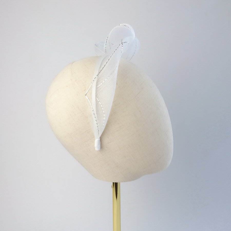 White Silver Crinoline Knot Headband worn to the right of the head