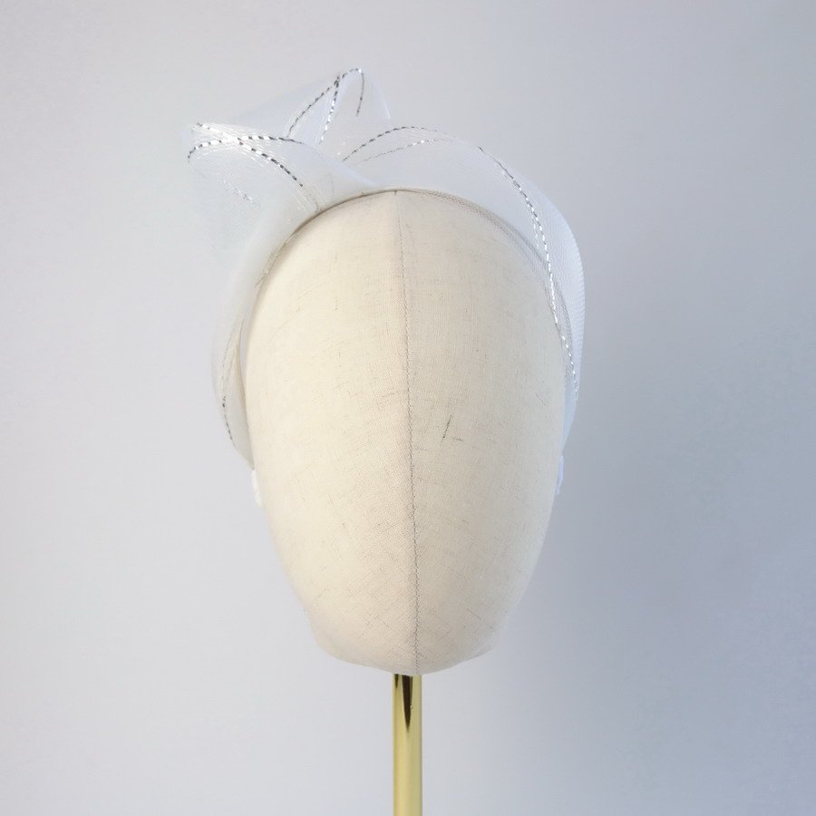 White Silver Crinoline Knot Headband worn to the right of the head