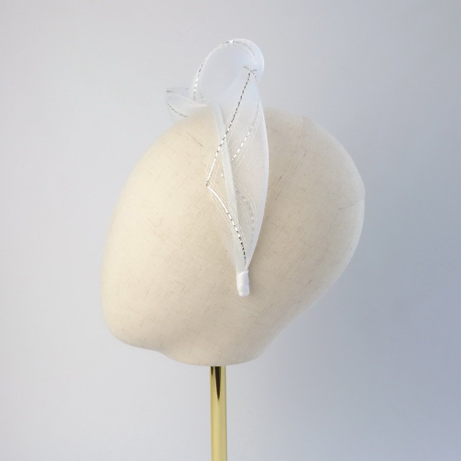 White Silver Crinoline Knot Headband worn to the left of the head