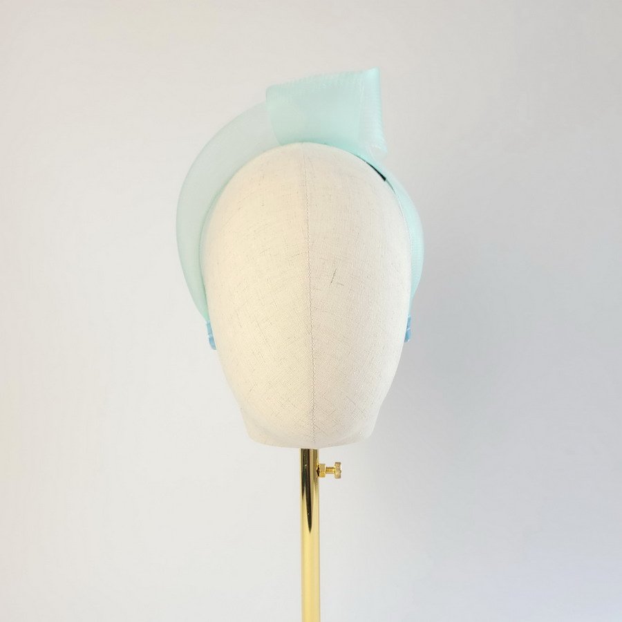 Aqua Blue Crinoline Knot Headband worn to the left of the head