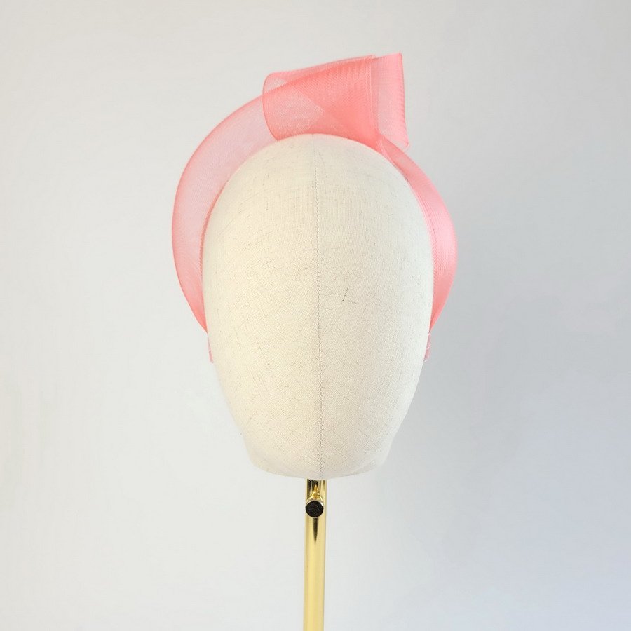 Coral Pink Crinoline Knot Headband worn to the left of the head