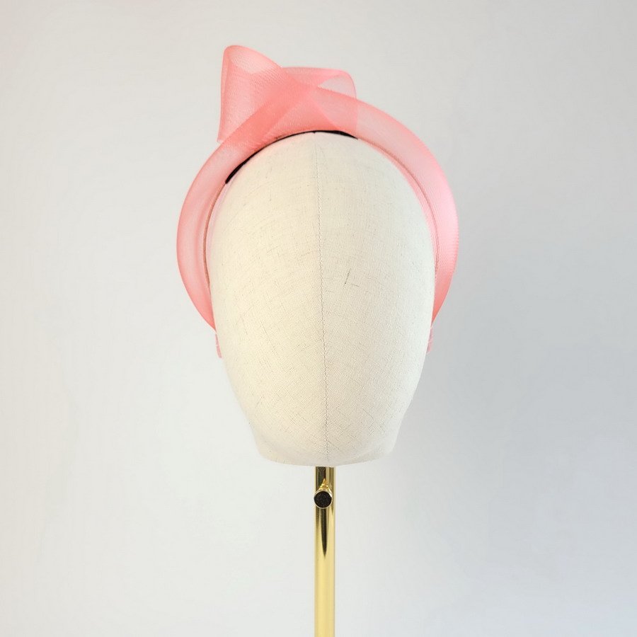Coral Pink Crinoline Knot Headband worn to the right of the head