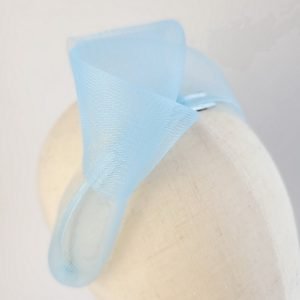 Detail of Cornflower Blue Crinoline Knot Headband worn to the right of the head