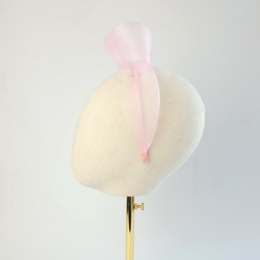 Pale Pink mesh knotted hair accessory worn to the left of the head