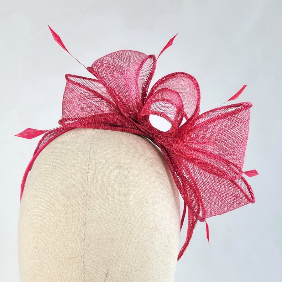 Fuchsia Pink Summer Hair Accessories - Front view of Fuchsia Pink Loop Fascinator with Coque Feathers, worn to the left