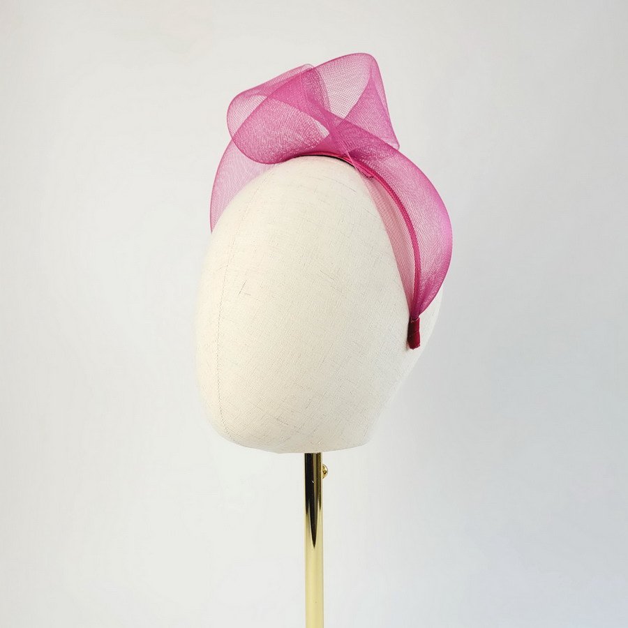 Dark Pink Statement Headband worn to the left of the head
