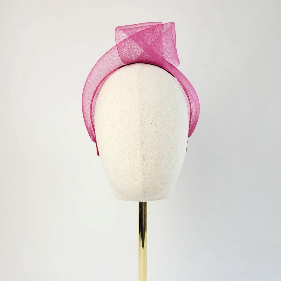 Dark Pink Crinoline Knot Headband worn to the left of the head