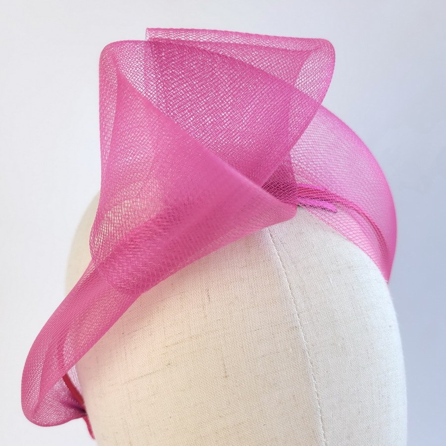 Detail of Dark Pink Crinoline Knot Headband worn to the right of the head