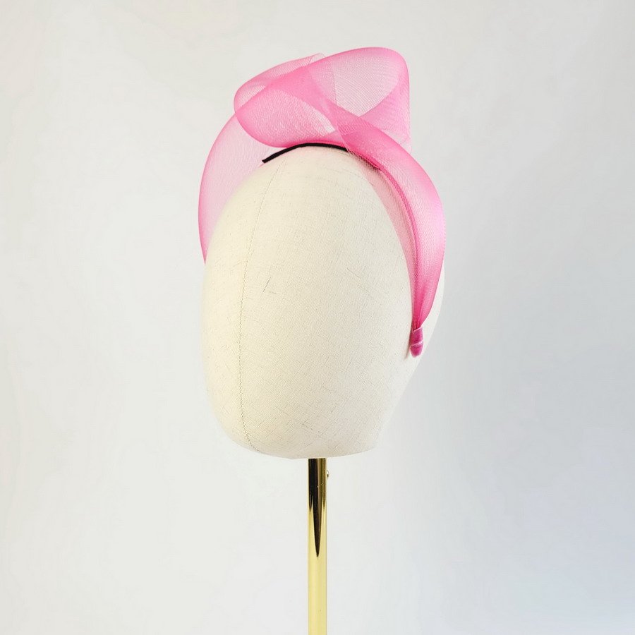 Fuchsia Crinoline Knot Headband worn to the left of the head