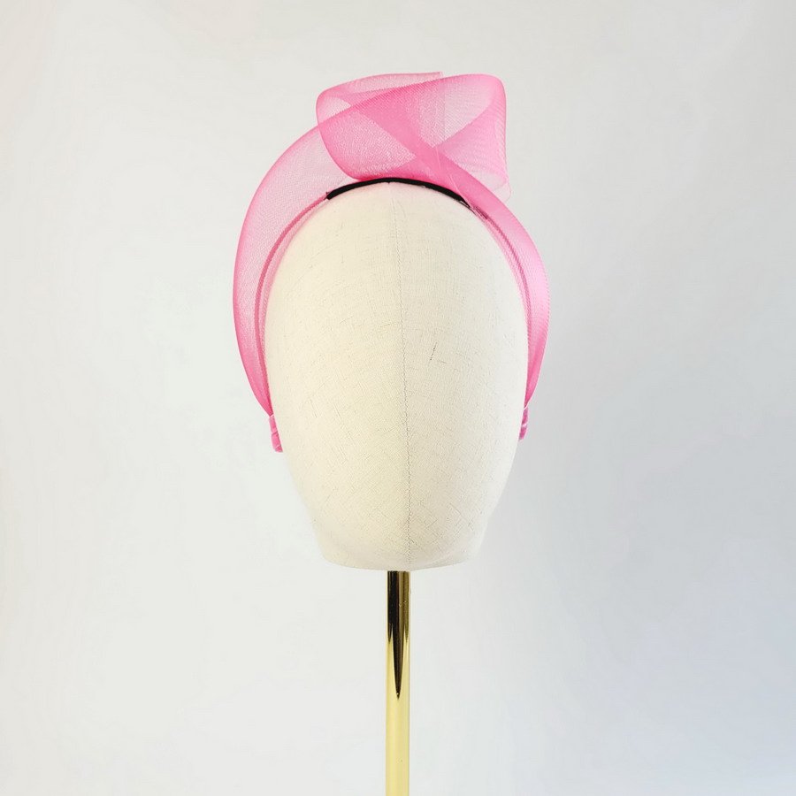 Fuchsia Crinoline Knot Headband worn to the left of the head