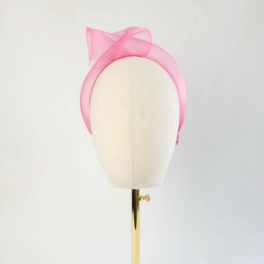 Fuchsia Crinoline Knot Headband worn to the right of the head