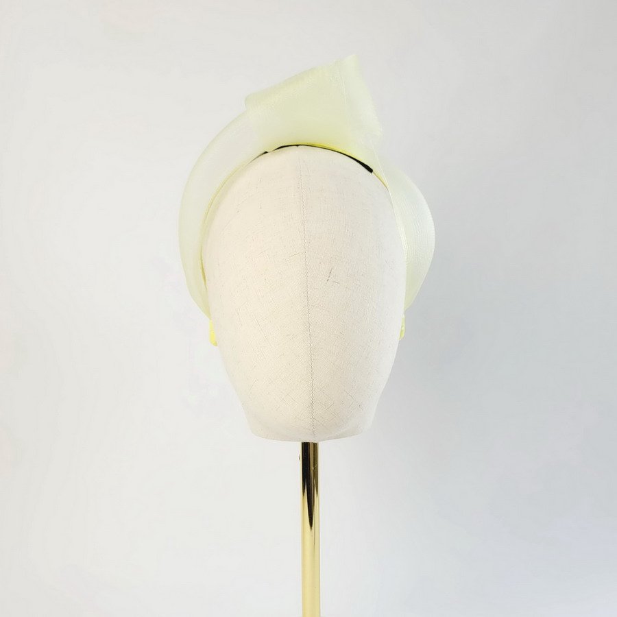 Pale Yellow Crinoline Knot Headband worn to the left of the head