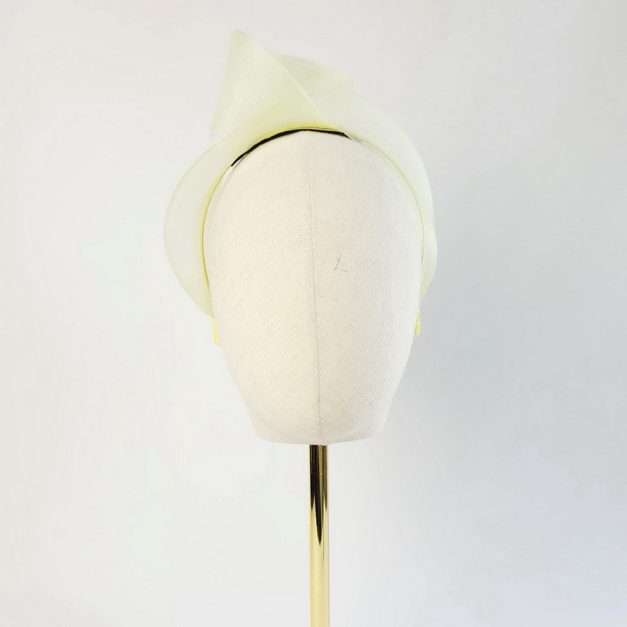 Pale Yellow Crinoline Knot Headband worn to the right of the head