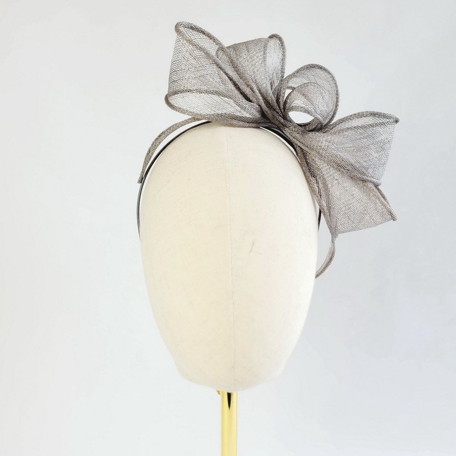 Grey Looped Fascinator Headband worn to the left of the head