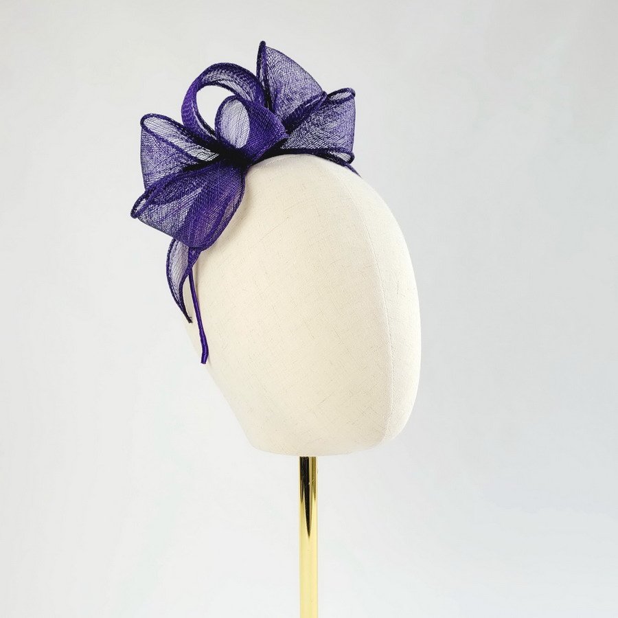 Purple Looped Fascinator Headband worn to the right of the head