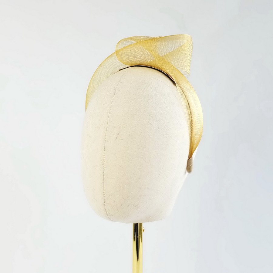 Mustard Yellow Crinoline Knot Headband worn to the left of the head