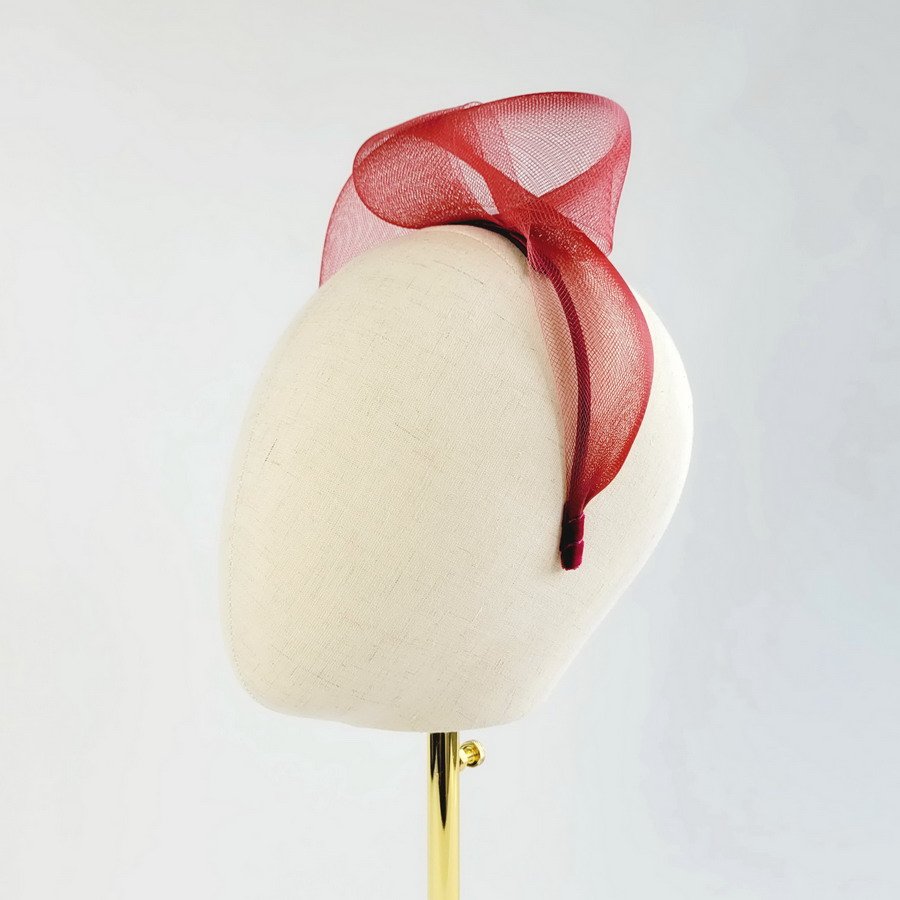 Wine Red Crinoline Knot Headband worn to the left of the head