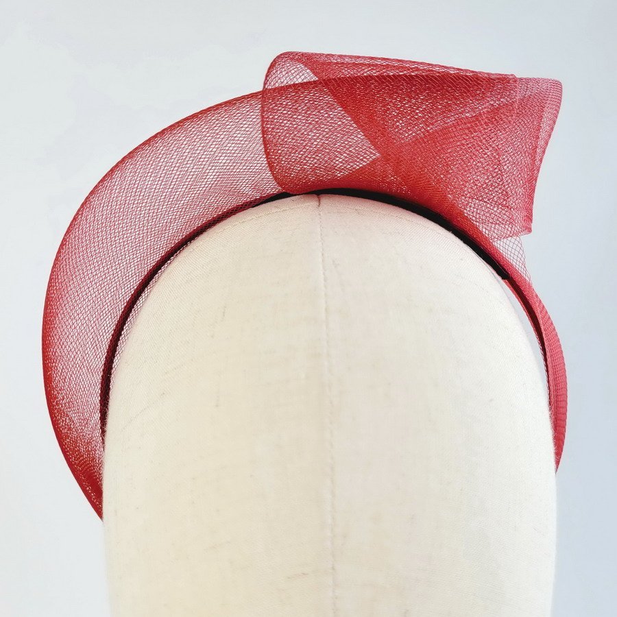Detail of Wine Red Crinoline Knot Headband worn to the left of the head