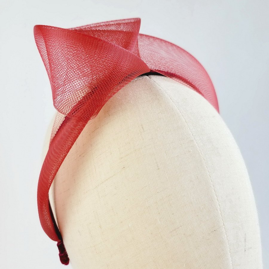 Detail of Wine Red Crinoline Knot Headband worn to the right of the head