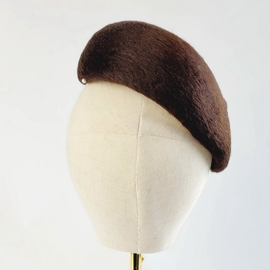 Back view of a brown percher hat handblocked using a vintage melusine felt.
