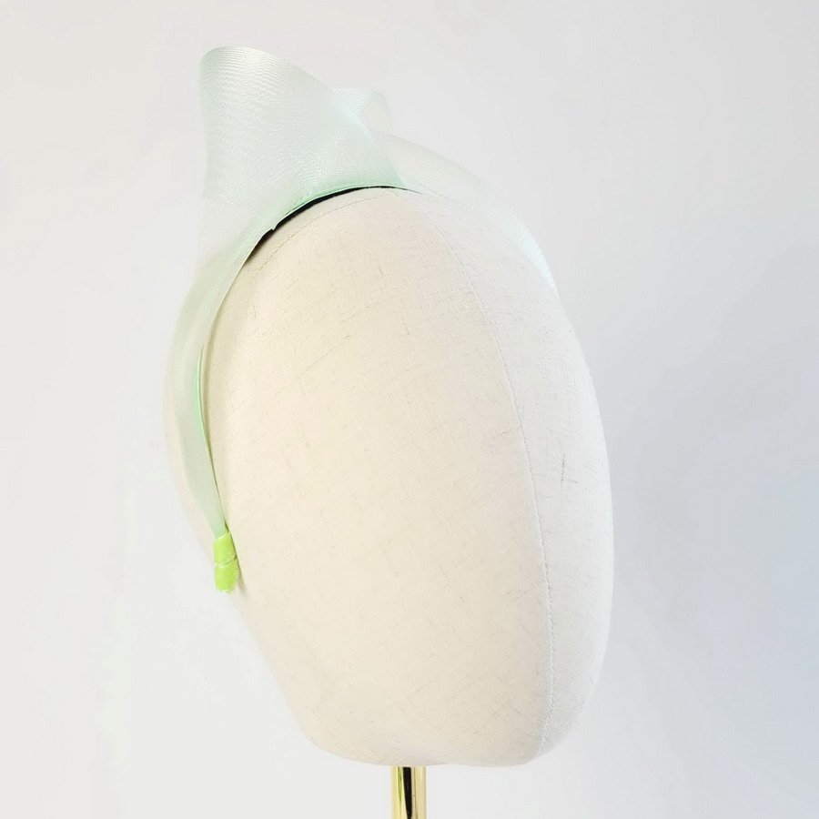 Mint Green Crinoline Knot Headband worn to the right of the head