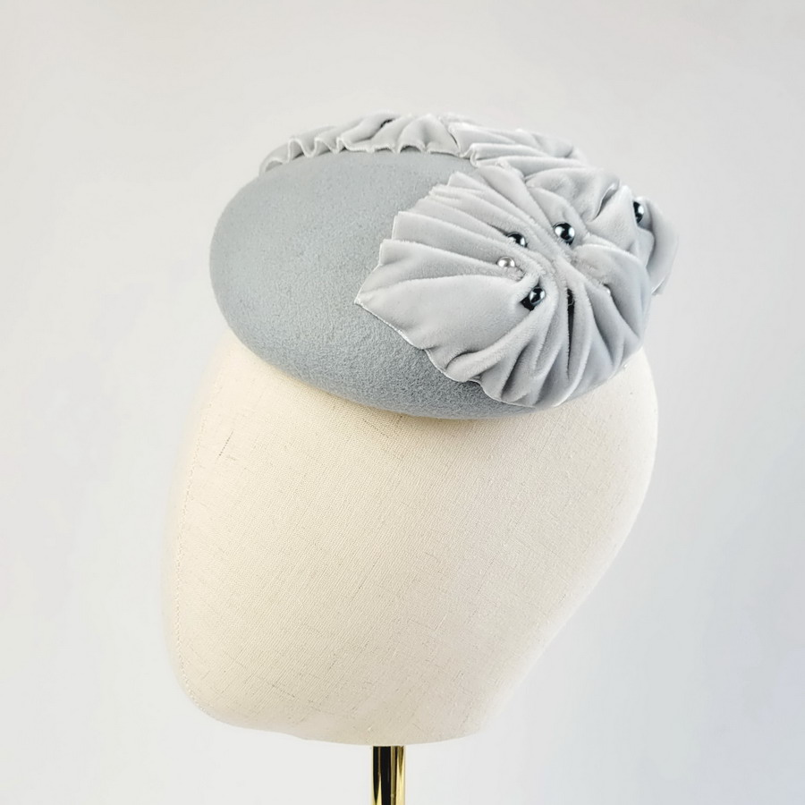Detail of an ice blue felt Autumn wedding hat