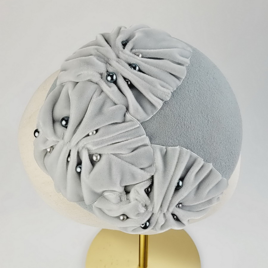 Detail of an ice blue felt winter wedding hat