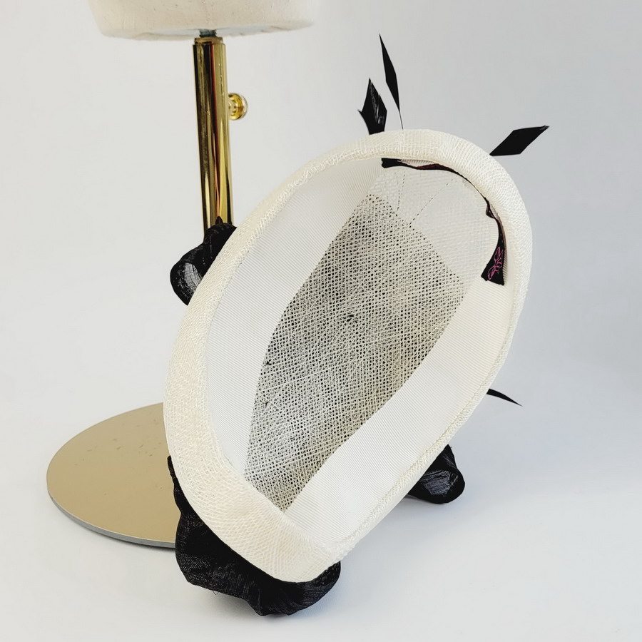 Inside an ivory and black handmade occasion half hat from Imogen's Imagination