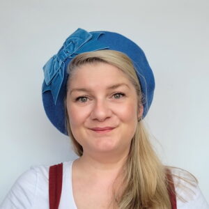 Airforce Blue Beret with Blue Velvet Ribbon Bow worn by a white woman in her 40s with long blonde hair