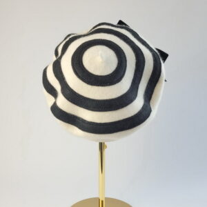 Back view of Bespoke Ivory Beret with Black Felt Circles and Black Bow