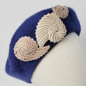 Detail of Bespoke Navy Beret with Cream Nautilus Shells